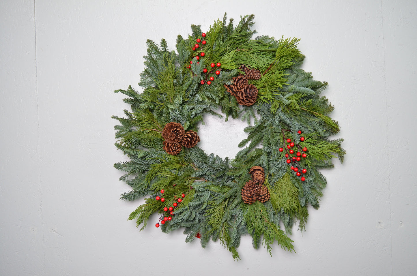 28" Noble Fir Wreath w/ Pinecones and artificial red berries