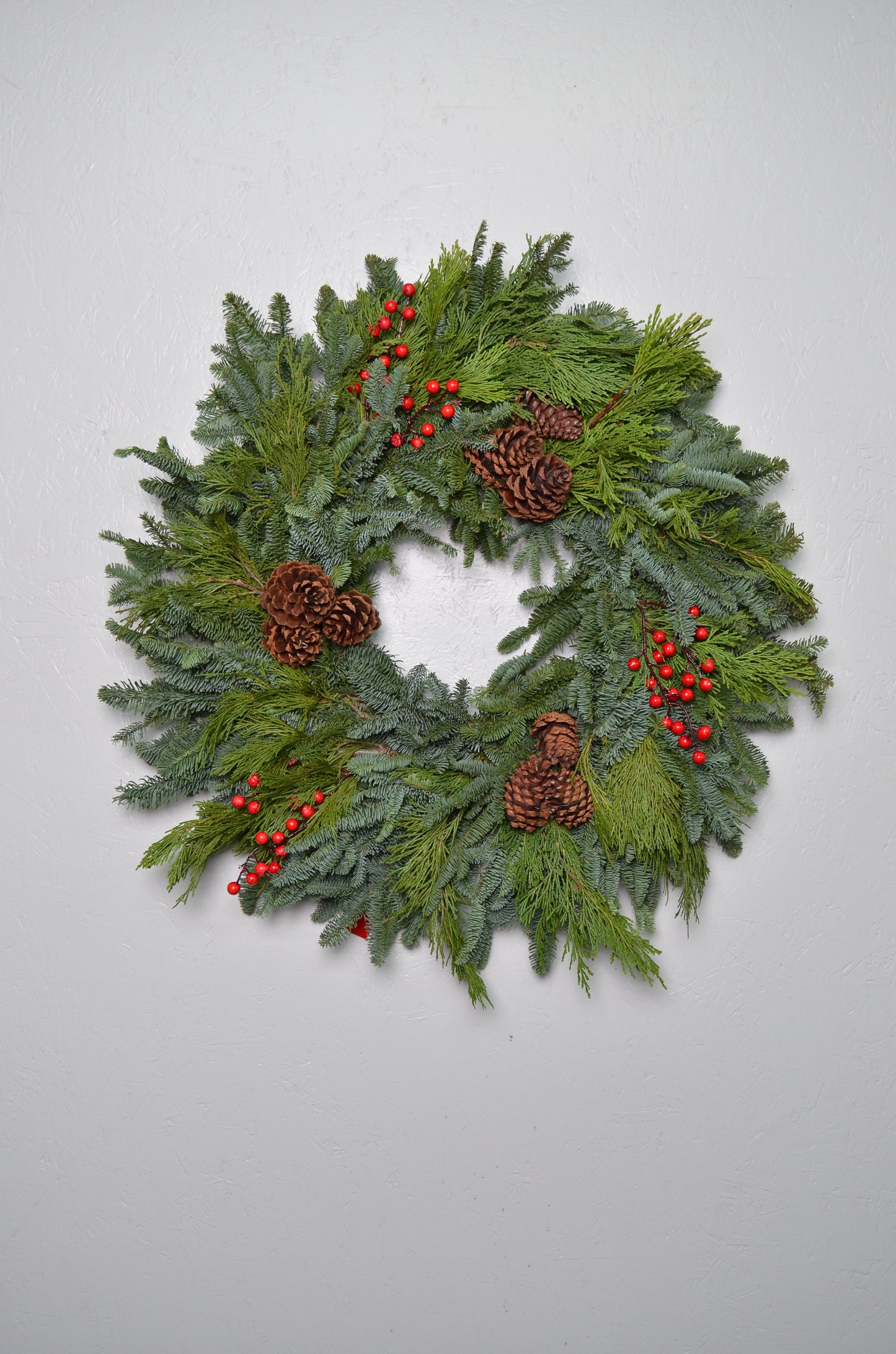 28" Noble Fir Wreath w/ Pinecones and artificial red berries